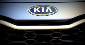 The Kia logo on the front of one of the Kia vehicles in Orangeburg, SC | Superior Kia