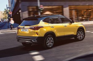 yellow 2021 kia seltos on the road