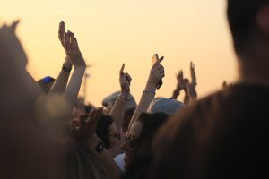People in a crowd at a festival