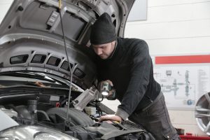 Mechanic servicing an engine near Orangeburg, SC