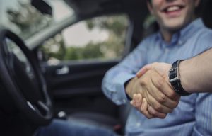 A person shaking a service tech's hand after an electrical system repair near Orangeburg, South Carolina.