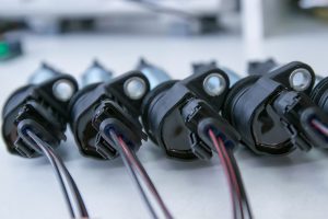 Four ignition coils lined up at a service center near Orangeburg, South Carolina