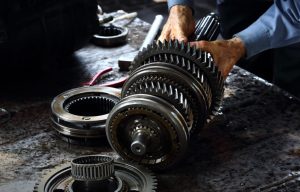 A person servicing a car's transmission near Orangeburg, South Carolina