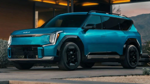 A blue 2024 Kia EV9 parked outside of a house near Orangeburg, South Carolina