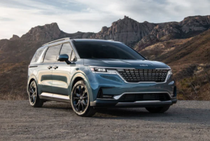 A 2024 Kia Carnival parked on a rocky road outdoors near Orangeburg, South Carolina