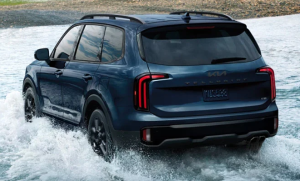 A 2025 Kia Telluride driving through shallow water near Orangeburg, SC