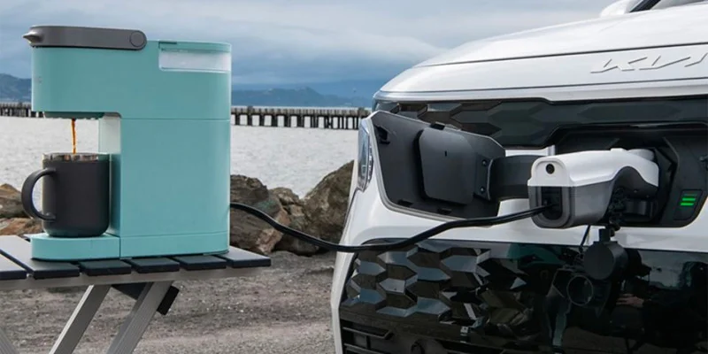 A 2025 Kia Niro EV being used to power a coffee maker